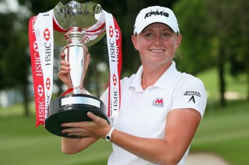 Stacy Lewis holds the winners trophy after her victory in Singapore.