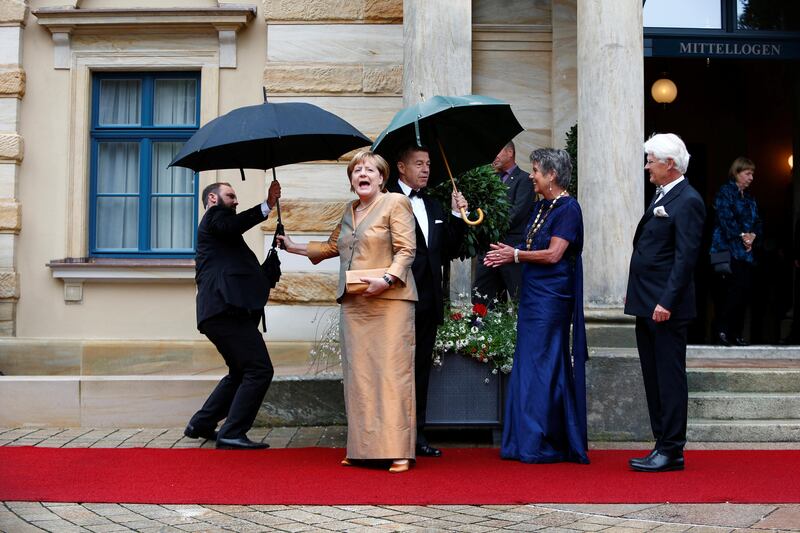 German Chancellor Angela Merkel reacts as she arrives at the red carpet for the opening of the Bayreuth Wagner opera festival outside the Gruener Huegel (Green Hill) opera house in Bayreuth, Germany July 25, 2017. REUTERS/Michaela Rehle     TPX IMAGES OF THE DAY