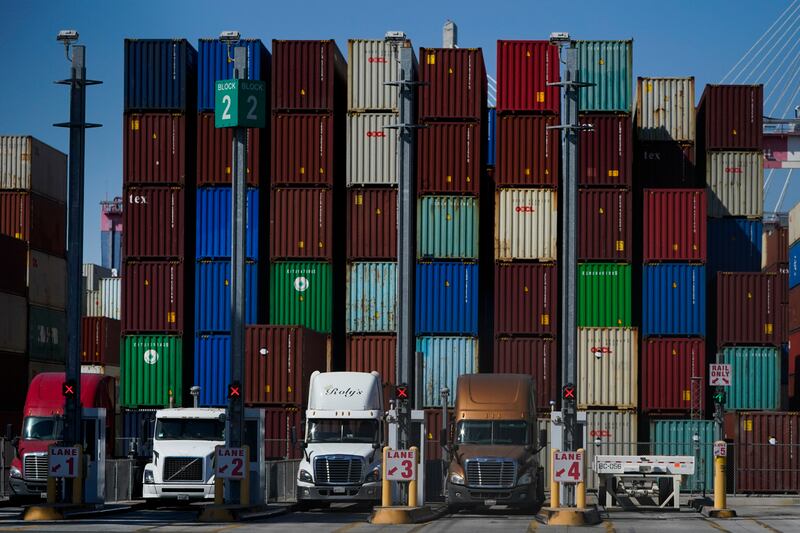 Containers are stacked at the Port of Long Beach in California. Global executives' sentiment is ending the year on a generally positive note, with most McKinsey survey respondents expecting 2022 to bring better economic conditions despite heightened risks from the pandemic and inflation. AP