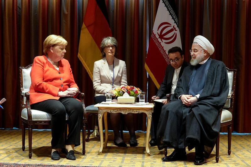 President Hassan Rouhani, right, meets Germany's Chancellor Angela Merkel, left, on the sideline of the United Nations General Assembly at the United Nations Headquarters.  AP