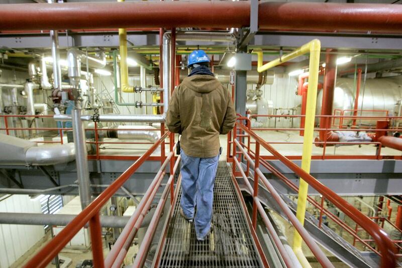 An employee walks among pipes and machinery that convert corn into ethanol inside the Lincolnway Energy plant in Nevada, Iowa. Jason Reed / Reuters