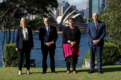 Liz Truss, left, British Defence Secretary Ben Wallace, second left, Australian Foreign Minister Marise Payne and Defence Minister Peter Dutton pose for a photo in Sydney