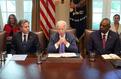 President Joe Biden, flanked by Secretary of State Antony Blinken and Secretary of Defence Lloyd Austin, in October 2023. Reuters