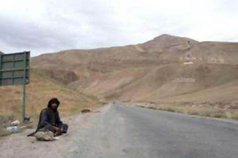 A man begs on the main road leading to the town of Pul-e-Khumri, where the insurgency is growing. BAGHLAN, AFGHANISTAN, JUNE 20, 2010: Chris Sands/The National