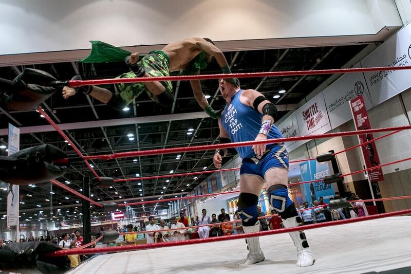 Crytpid flies at Rich 'N' Famous during a Dubai Pro Wrestling match. Reem Mohammed / The National