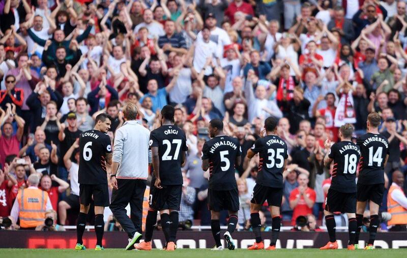 Liverpool manager Jurgen Klopp celebrates with their players and fans after the match against Arsenal at the Emirates Stadium in London, Britain, 14 August 2016. Tony O’Brien / Action Images / Reuters