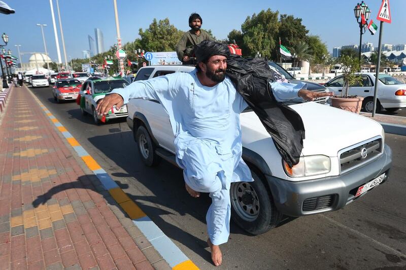 Merry-makers began arriving at the Corniche by afternoon. Fatima Al-Marzooqi / The National