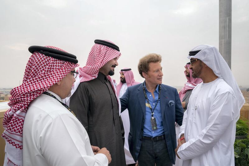 RIYADH, SAUDI ARABIA - December 15, 2018: HH Sheikh Mohamed bin Zayed Al Nahyan, Crown Prince of Abu Dhabi and Deputy Supreme Commander of the UAE Armed Forces (R) attends the final day of the 2018 Formula E Saudi Ad Diriyah E-prix.

( Mohamed Al Hammadi / Ministry of Presidential Affairs )
---