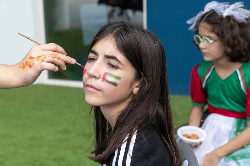 A pupil gets her face painted at Bloom World Academy.
Antonie Robertson/The National