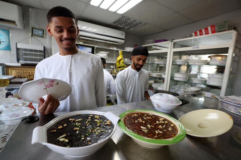 Abu Dhabi, United Arab Emirates - June 03, 2019: Omani halwa is served to customers as people prepare for Eid. Monday the 3rd of June 2019. Bani Yas, Abu Dhabi. Chris Whiteoak / The National