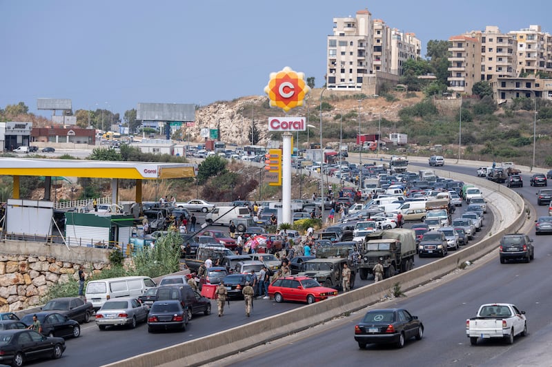 A crowded petrol station on the main road that links Beirut to south Lebanon. AP