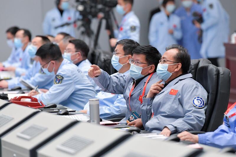 Technical personnel monitoring the process during the Chang'e-5 lunar probe landing on the moon at the Beijing Aerospace Control Centre in Beijing. AFP