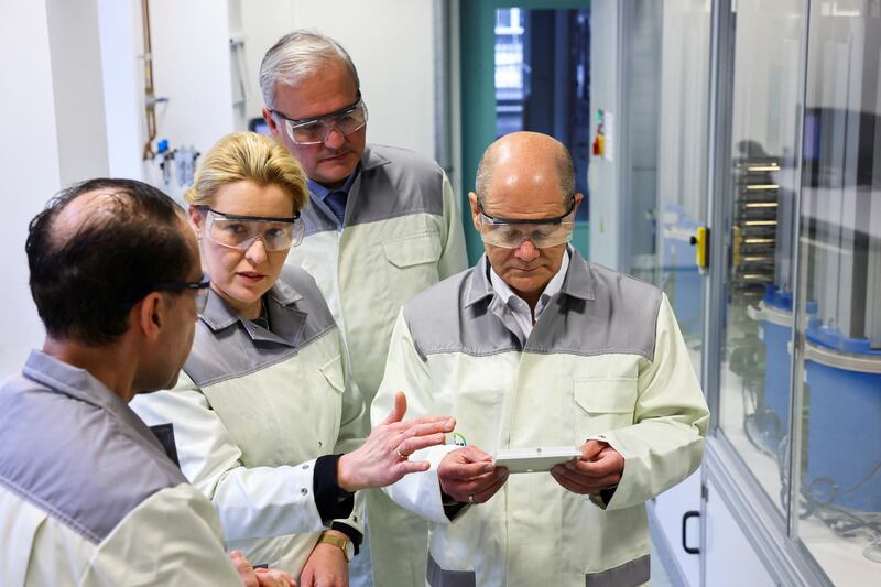 Olaf Scholz, right, joined Berlin mayor Franziska Giffey, second left, on the campaign trail at a science lab. Reuters