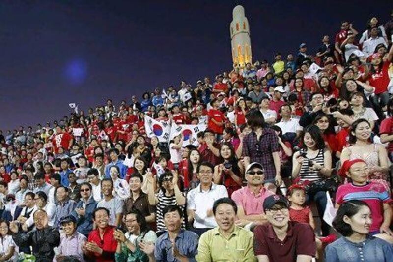 South Korean fans attend a World Cup qualifier in Dubai. Growing trade links with the UAE has led to 7,000 South Koreans taking up residence in the Emirates. Mike Young / The National