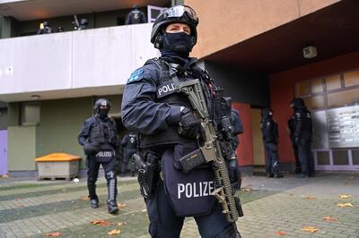 BERLIN, GERMANY - NOVEMBER 17: Heavily-armed police stand outside an apartment building in Kreuzberg district during raids in which police arrested three suspects in connection with last year's spectacular robbery in the Gruenes Gewoelbe museum in Dresden on November 17, 2020 in Berlin, Germany. On November 25, 2019, thieves entered the museum and stole a wide variety of priceless jewels. (Photo by Sean Gallup/Getty Images)