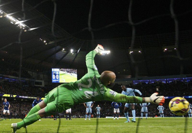 Yaya Toure shoots and scores a penalty past Everton keeper Tim Howard in Manchester City's 1-0 Premier League victory at the Etihad Stadium on Saturday. Darren Staples / Reuters