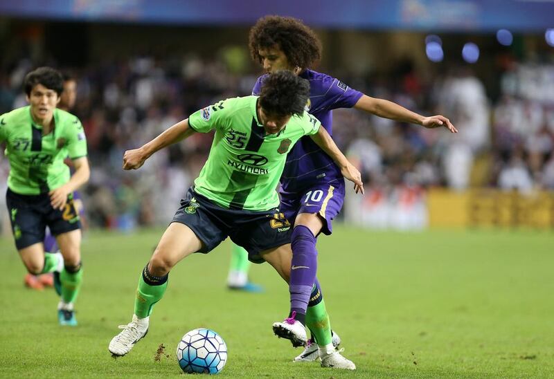 Omar Abdulrahman attempts to tackle Choi Chul Soon during the Asian Champions League final second leg. Pawan Singh / The National