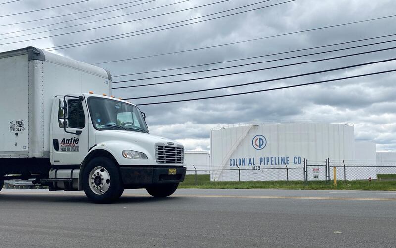 A truck passes holding tanks at Colonial Pipeline's Linden Junction Tank Farm in Woodbridge, New Jersey. The US government issued emergency laws to allow for fuel to be transported by road. Reuters