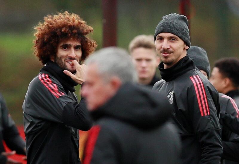 Soccer Football - Champions League - Manchester United Training - Aon Training Complex, Manchester, Britain - November 21, 2017   Manchester United's Marouane Fellaini and Zlatan Ibrahimovic look at manager Jose Mourinho during training   Action Images via Reuters/Jason Cairnduff