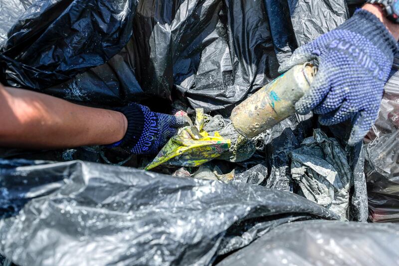 Abu Dhabi, United Arab Emirates, June 15, 2019.  
AUH clean up mission by volunteers at the Abu Dhabi Dhow Harbour. --  Assorted bottles, aluminum cans and other trash debris collected by the volunteers.
Victor Besa/The National
Section:  NA
Reporter:  Anna Zacharias