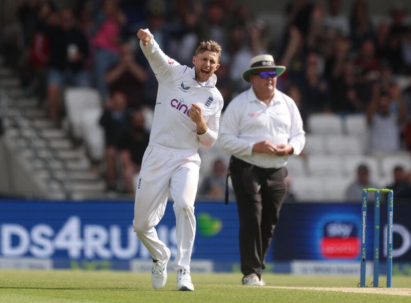 England's Joe Root celebrates taking the wicket of New Zealand batsman Devon Conway for 11. Reuters