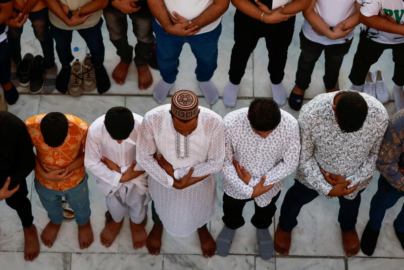 Sunnis at prayer on the first day of Eid at the shrine of cleric Sheikh Abdul Qadir al-Gailani in Baghdad, Iraq. Reuters