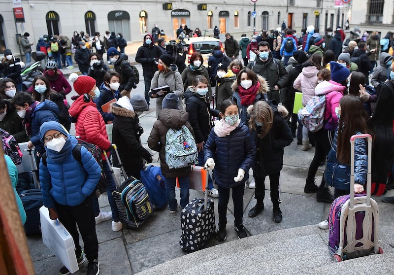 Students gather outside Tommaseo School in Turin. EPA