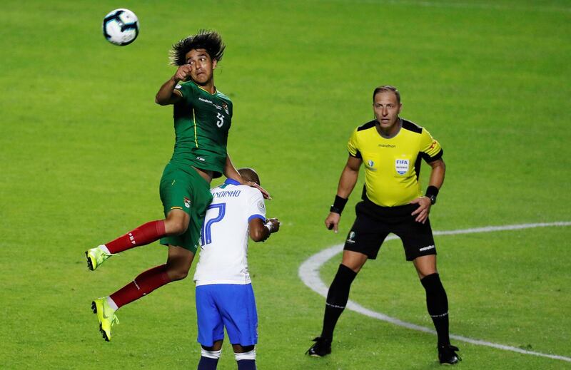 David Neres, centre, of Brazil vies for the ball with Marcelo Martinsof Bolivia. EPA