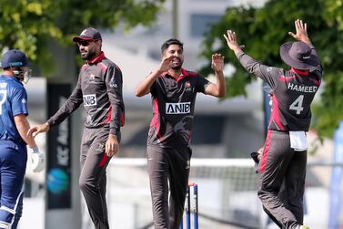 Junaid Siddique, centre, is only three ODIs into his UAE career but is already viewed as the side's senior bowler. Pawan Singh / The National