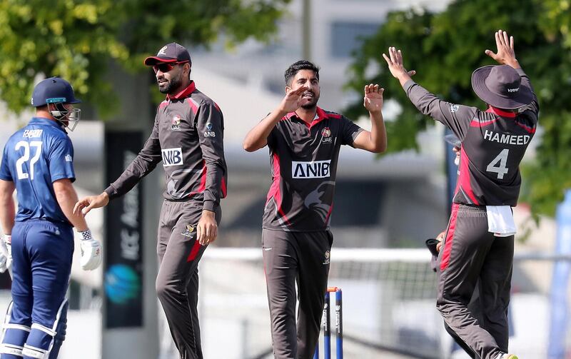 DUBAI, UNITED ARAB EMIRATES , Dec 12– 2019 :- Junaid Siddique of UAE (center) celebrating after taking the wicket of Cameron Stevenson during the World Cup League 2 cricket match between UAE vs USA held at ICC academy in Dubai. ( Pawan Singh / The National )  For Sports. Story by Paul