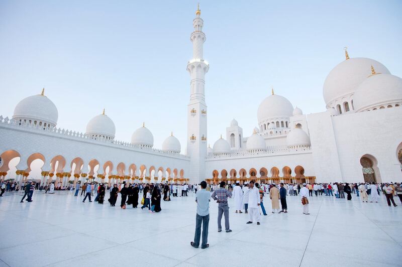 November 15, 2010 / Abu Dhabi / (Rich-Joseph Facun / The National) People gather at the Sheikh Zayed Grand Mosque for the Eid al-Adha Prayer, Tuesday, November 15, 2010 in Abu Dhabi. The Sheikh Zayed Grand Mosque is the largest mosque in the United Arab Emirates. 