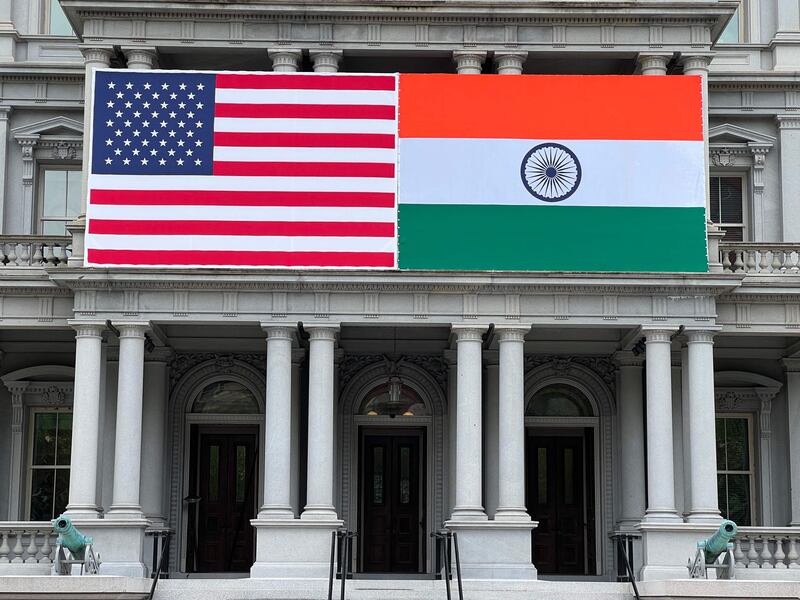 The flags of India and the US adorn the Eisenhower Executive Office Building in Washington. AP