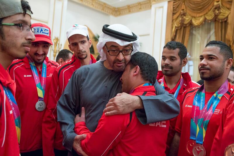 ABU DHABI, UNITED ARAB EMIRATES - January 11, 2016: HH Sheikh Mohamed bin Zayed Al Nahyan Crown Prince of Abu Dhabi Deputy Supreme Commander of the UAE Armed Forces (R), greets a member of the UAE Disabled Sports Federation during a Sea Palace barza.

( Mohamed Al Hammadi / Crown Prince Court - Abu Dhabi )
---