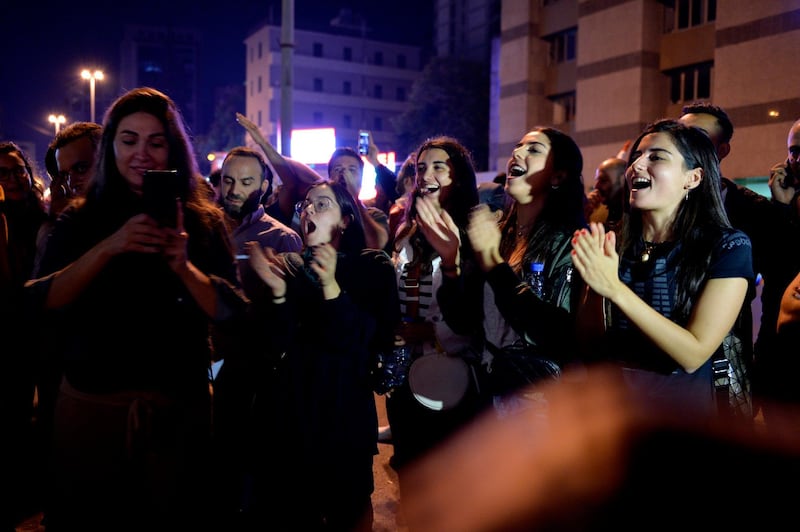 Protesters shout slogans as they block the main highway during ongoing anti-government protests near downtown in Beirut, Lebanon.  EPA