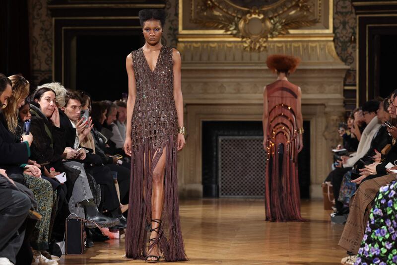 A latticework of golden beading in the desert-inspired collection. AFP