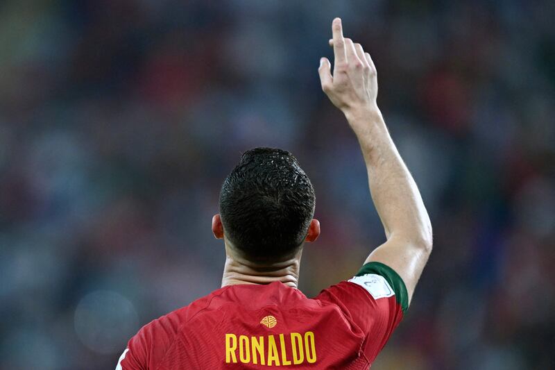 Cristiano Ronaldo celebrates scoring his team's first goal during Portugal's 3-2 over Ghana. He broke another record by becoming the only player to score in five World Cup tournaments. AFP