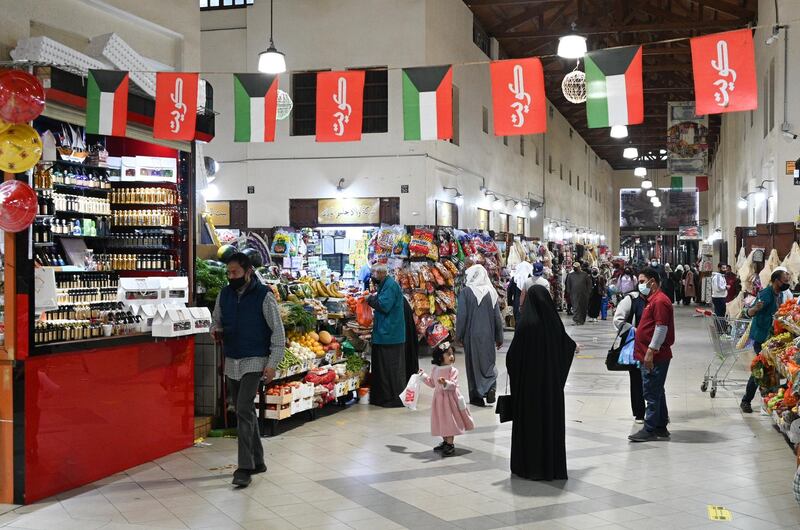 Shoppers at Kuwait City's Souk Al Mubarakiya. Under coronavirus restrictions, Kuwait's beauty salons and gymnasiums are closing, and restaurants are being limited to takeaway services. EPA