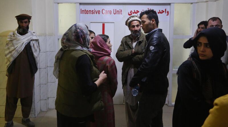 Relatives of injured students wait outside the Intensive care unit (ICU) ward in a hospital after an attack at Kabul University in Kabul, Afghanistan.   EPA