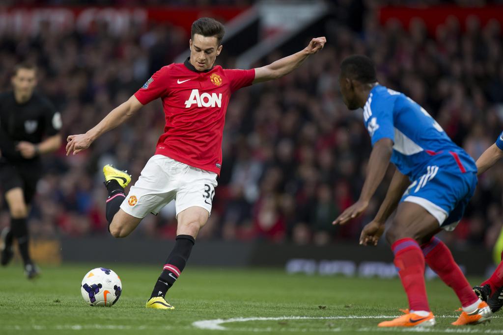 Manchester United player Tom Lawrence, left, takes a shot against Hull City on Tuesday. Jon Super / AP / May 6, 2014