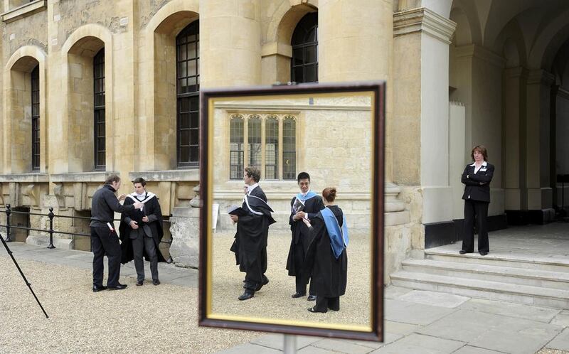 Graduates queue to have their photograph taken after a graduation ceremony at Oxford University in England. Paul Hackett/Reuters