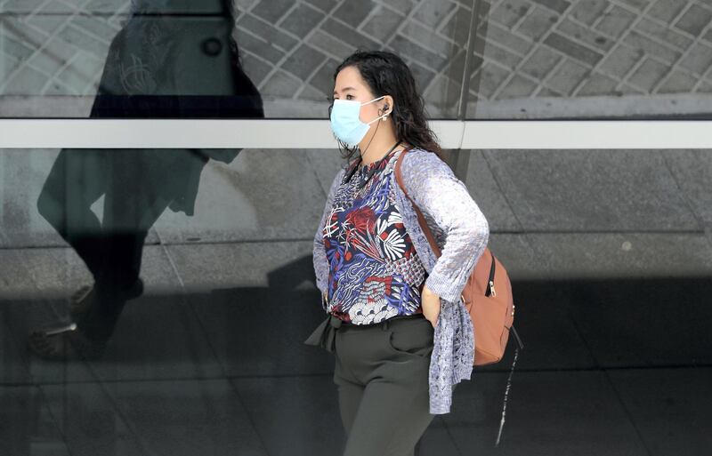 DUBAI, UNITED ARAB EMIRATES , March 19 – 2020 :- One of the commuter wearing protective face mask as a preventive measure against coronavirus near the Sharaf DG metro station in Al Barsha in Dubai. (Pawan Singh / The National) For Standalone/News/Online