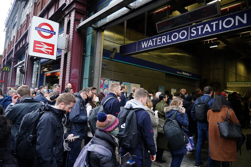 Commuters queue outside Waterloo station in London, as tube services remained disrupted on Wednesday morning. PA