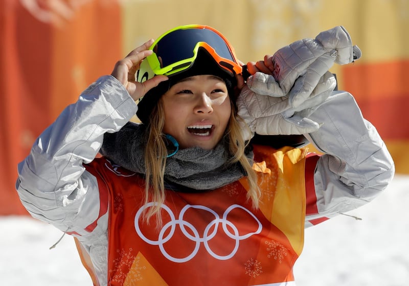 FILE - In this Tuesday, Feb. 13, 2018 file photo, ChloeÂ Kim, of the United States, smiles during the women's halfpipe finals at Phoenix Snow Park at the 2018 Winter Olympics in Pyeongchang, South Korea. A San Francisco Bay Area radio station has fired one of its hosts, Patrick Connor, after he made sexual comments about 17-year-old Olympic snowboarder Kim on another station. Program director Jeremiah Crowe of KNBR-AM, where Connor hosted "The Shower Hour," confirmed the firing Wednesday, Feb. 14, 2018, for NBC Bay Area. (AP Photo/Lee Jin-man, File)