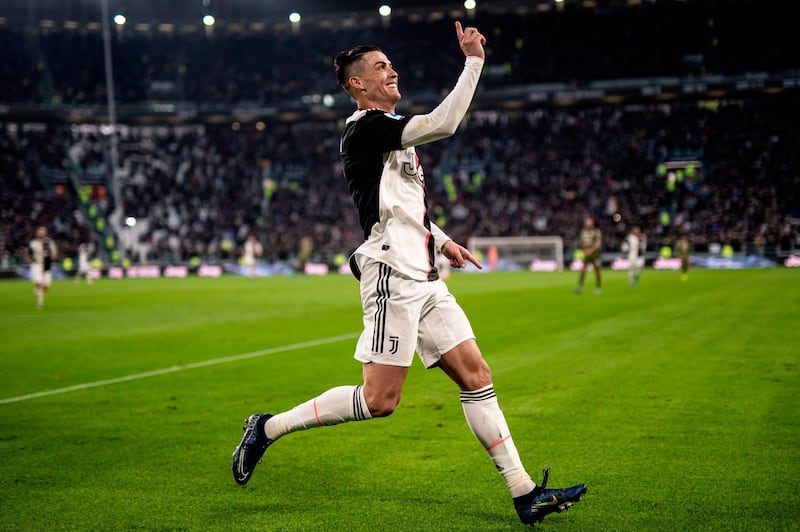Cristiano Ronaldo celebrates after scoring his third goal. AFP