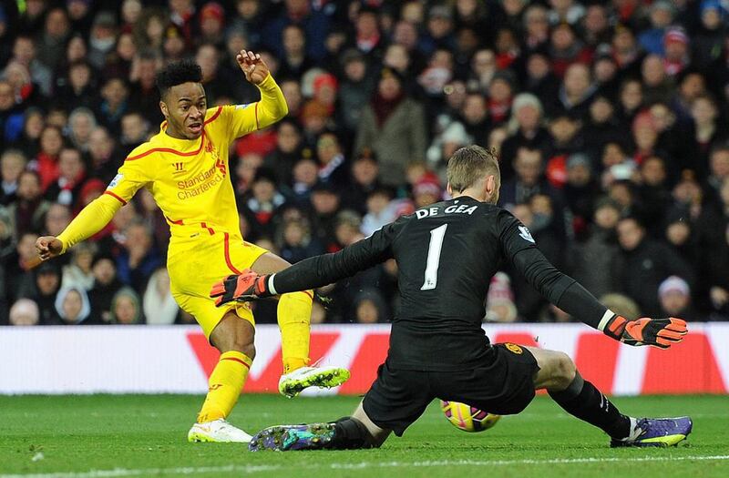 Manchester United's David De Gea stops a shot from Liverpool's Raheem Sterling during their Premier League match on Sunday. Peter Powell / EPA