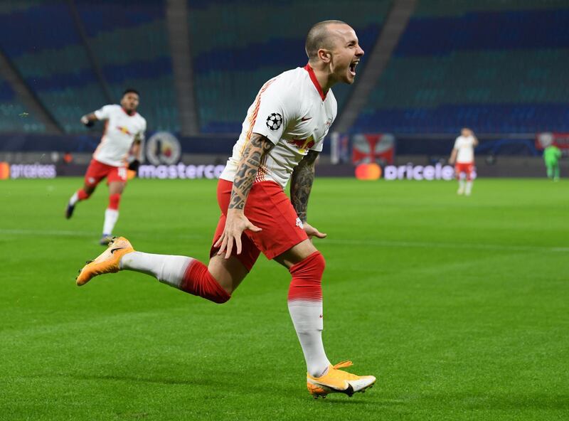 LWB: Angelino (RB Leipzig) - The Spaniard made full use of ample space to ambush United. That's three goals and three assists in the group phase for the Manchester City loanee. Reuters