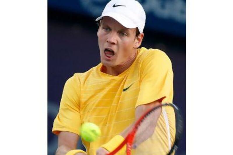 Tomas Berdych plays a shot during his win over Nikolay Davydenko in Dubai yesterday.