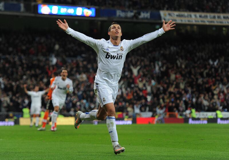 MADRID, SPAIN - DECEMBER 04:  Cristiano Ronaldo of Real Madrid celebrates scoring his sides opening goal during the La Liga match between Real Madrid and Valencia at Estadio Santiago Bernabeu on December 4, 2010 in Madrid, Spain.  (Photo by Jasper Juinen/Getty Images)