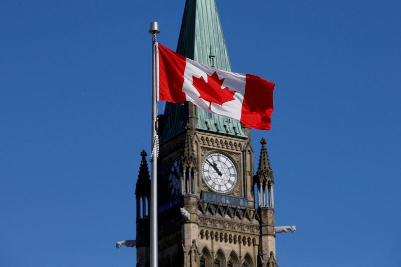 A Canadian flag flies in front of the Peace Tower on Parliament Hill in Ottawa, Ontario. Reuters
