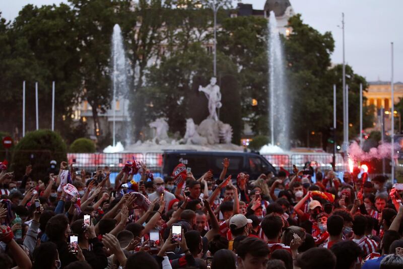 Atletico Madrid fans celebrate the La Liga title at Neptuno Fountain in downtown in Madrid. EPA